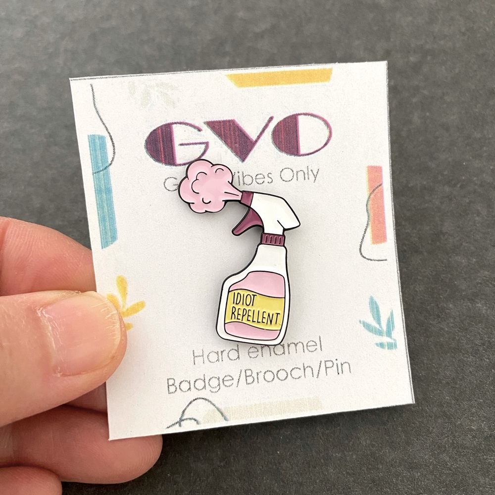 Idiot repellent spray brooch, enamel pin
